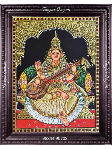 Handmade Saraswathi Tanjore painting with veena, gold foil detailing and traditional archwork